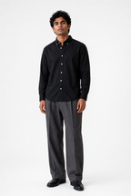 Cauzeway solid black Oxford cotton casual shirt in signature Indian regular fit, front view.