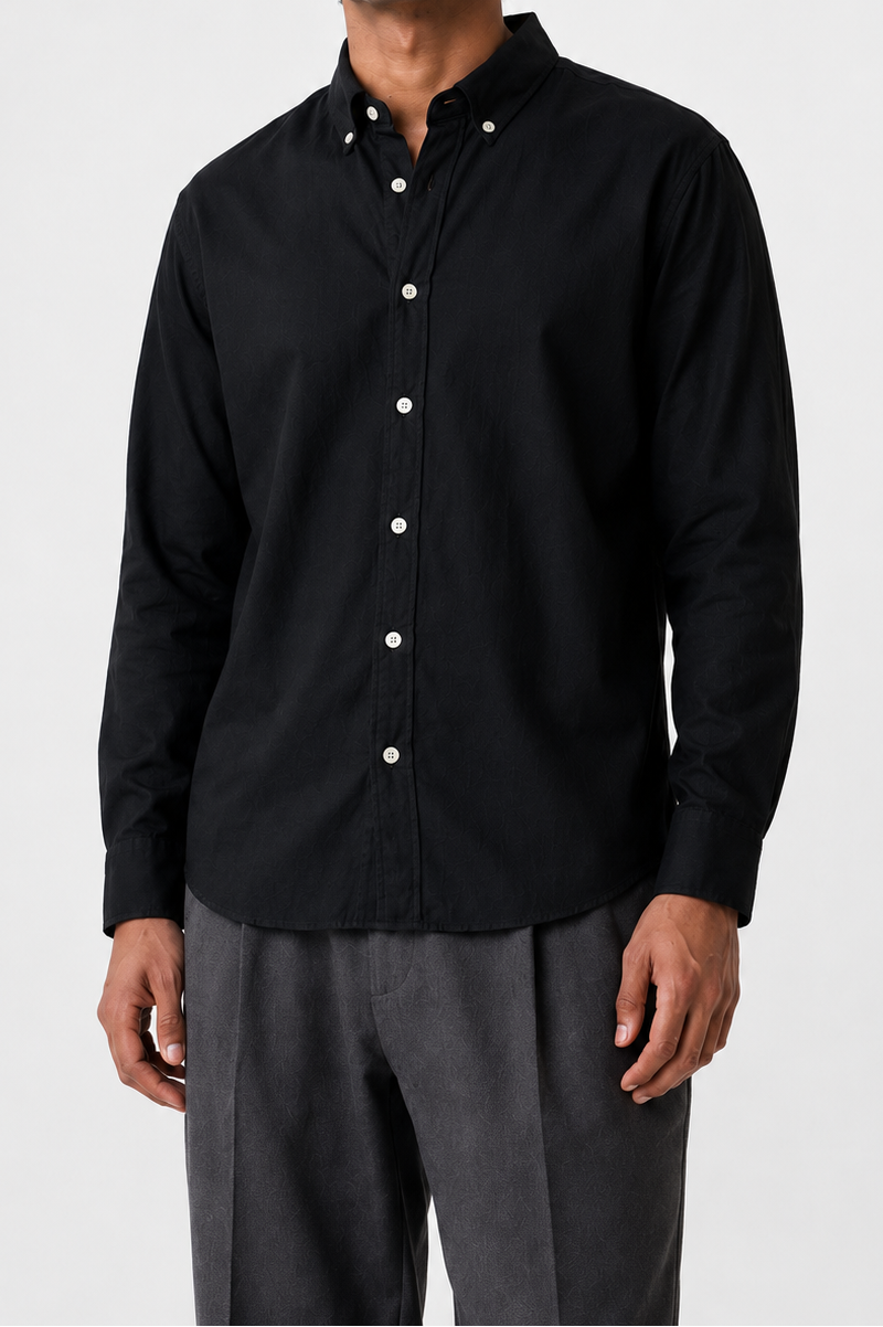 Model wearing Cauzeway black Oxford cotton shirt with button-down collar, front view