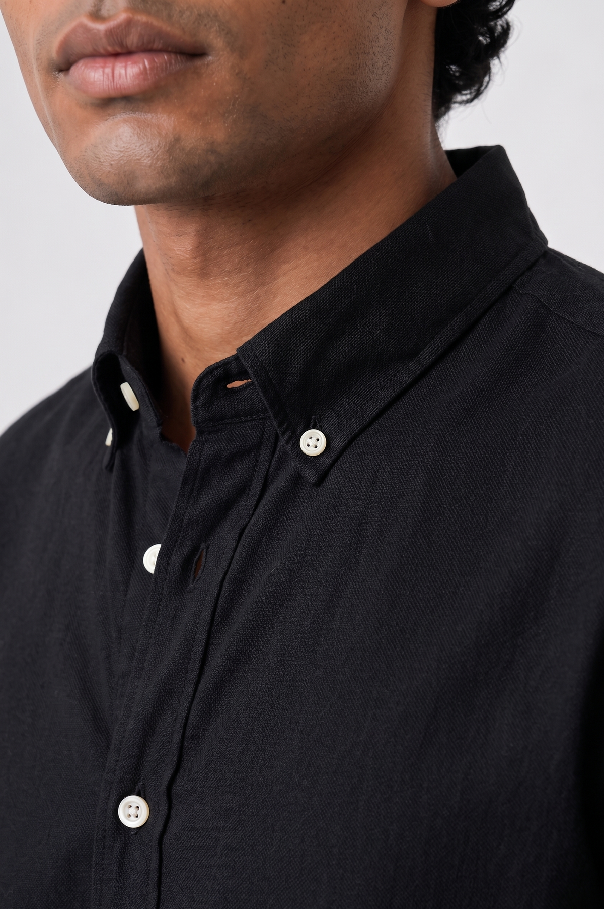 Cauzeway solid black Oxford cotton casual shirt styled with button-down collar, close view