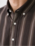 Close up of the button-down collar and shadow stripe weave on Cauzeway brown casual shirt.