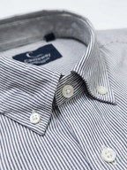 Close up of the button-down collar and pencil stripe weave on Cauzeway charcoal grey shirt.