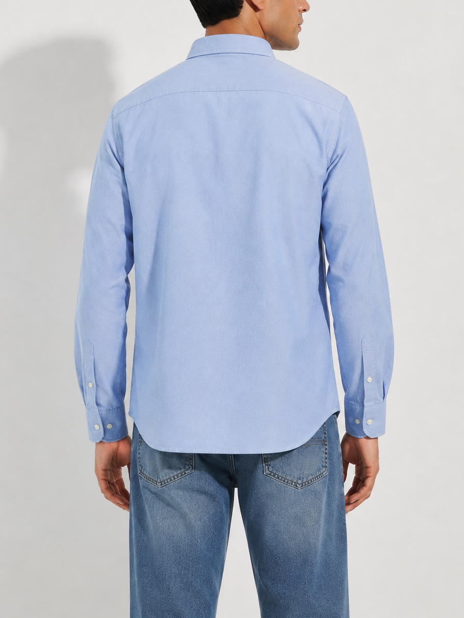 Cauzeway chambray blue Oxford cotton casual shirt in signature Indian regular fit, back view.