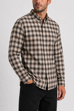 Model showcasing the rich tonal drape of Cauzeway brown shadow check shirt engineered for the Indian body type, styled untucked with dark denim.