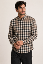 Model showcasing the rich tonal drape of Cauzeway brown shadow check shirt engineered for the Indian body type, styled untucked with dark denim.