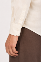 Close up of the tailored button cuff on Cauzeway heritage off-white cotton casual shirt