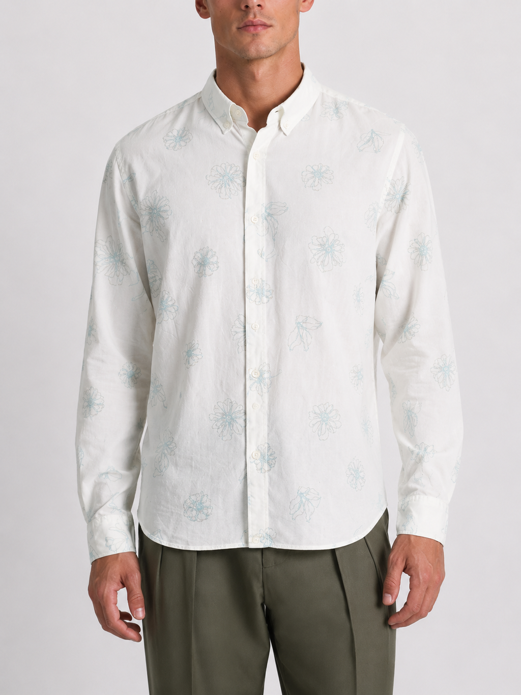 Close up of the floral outline print and cotton linen weave on Cauzeway white casual shirt.