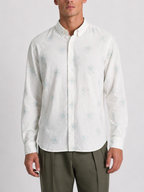 Close up of the floral outline print and cotton linen weave on Cauzeway white casual shirt.