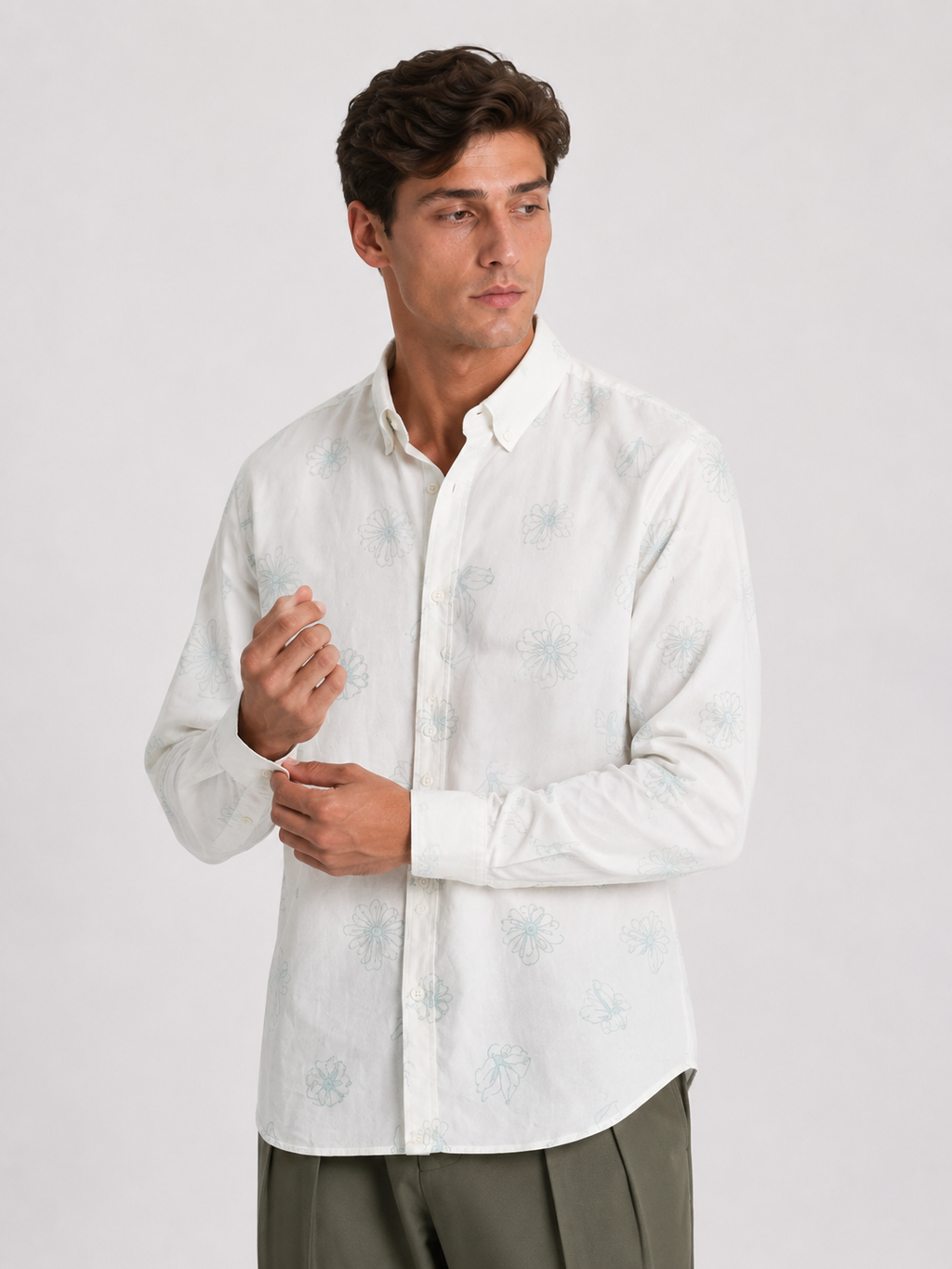 Cauzeway white floral print casual shirt styled with button-down collar, three-quarter view.