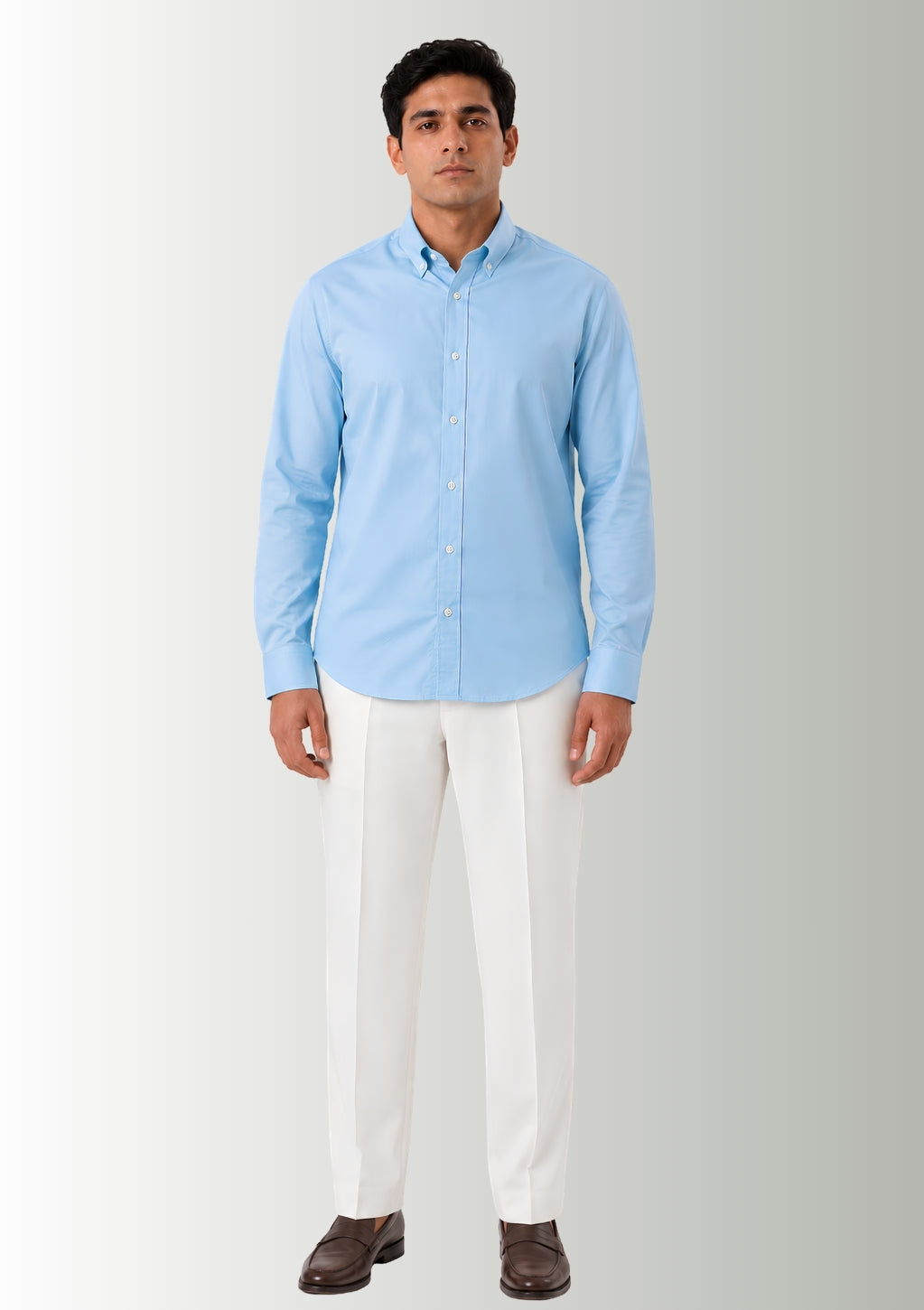 Model demonstrating the flexible stretch and clean drape of Cauzeway sky blue bamboo blend shirt engineered for Indian men, styled untucked.