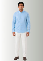 Model demonstrating the flexible stretch and clean drape of Cauzeway sky blue bamboo blend shirt engineered for Indian men, styled untucked.