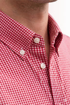 Close up texture of the premium 100% cotton TFO oxford basketweave and structured button down collar on a Cauzeway red check casual shirt.