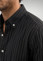 Close up of the black pinstripe pattern on premium 100% cotton TFO oxford fabric and structured button down collar by Cauzeway.