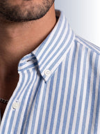Close up texture of the iconic white and blue university stripe pattern on premium 100% cotton TFO oxford fabric by Cauzeway.